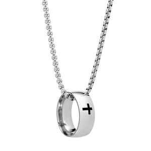 Macro detail of silver ring pendant with black cross motif on polished stainless steel chain