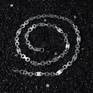 Polished stainless steel hip hop chain necklace with oval and H-link joins on dark stones