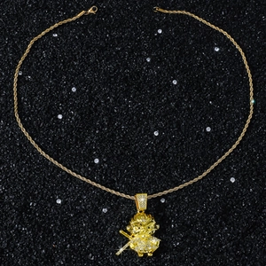 Macro shot of hip-hop Sun Wukong monkey pendant with shiny crystals and twist rope chain