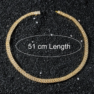 Detail view of gold iced-out V-shape chain showing 51cm length and hip-hop design