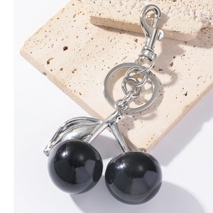 Creative black resin cherry keychain pendant with polished silver alloy ring and lobster clasp