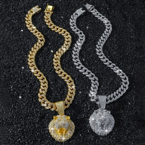 Iced out lion head pendant necklace with Cuban chain in gold and silver hip hop style