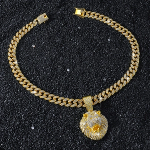 Close-up of hip hop gold lion head pendant with iced out cuban link chain