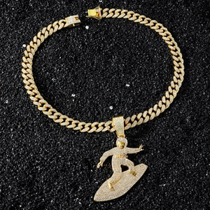 Close-up of hip hop cuban chain with gold-plated iced out skater boy pendant necklace