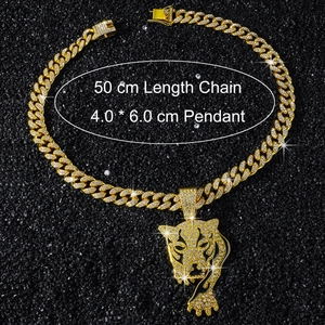 Close-up of hip-hop gold Cuban link chain with iced-out leopard head pendant and dimensions