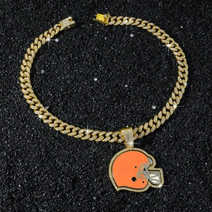 Macro view of iced out gold cuban link necklace with orange football helmet pendant
