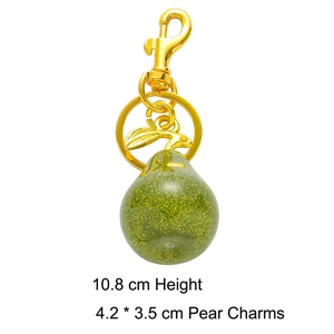 Detail showing glittery green resin pear keychain dimensions 10.8cm with gold clip