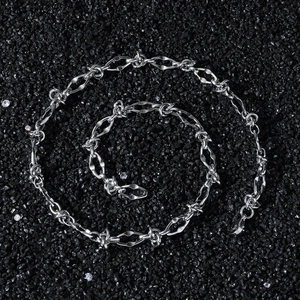 Mens hip hop stainless steel thorny knotted chain necklace on black textured stone