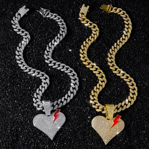 Hip hop cuban chain necklace with iced out broken heart pendant and lightning bolt detail