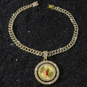Macro shot of hip hop spinning Virgin Mary pendant with cubic zirconia and enamel on cuban chain