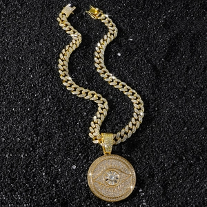 Iced out gold hip hop Cuban chain necklace with a large crystal evil eye round pendant