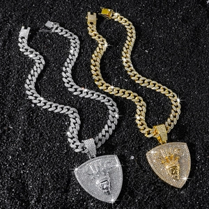 Gold and silver hip hop necklaces with crowned lion shield pendants and iced out chains