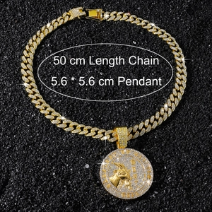 Close-up of golden iced-out cuban chain necklace with a 5.6cm goat medallion pendant