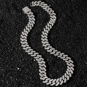 Men's hip hop 14mm iced out diamond rhombus cuban link necklace on black sand background