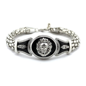 Detail of silver lion head medal with black enamel and rhinestones on braided chain