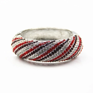 Close-up of wide alloy bangle with diagonal red, black and white rhinestone pave setting
