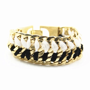 Detail of chunky two-row woven alloy chain bracelet with black and white threads