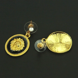 Vintage style gold lion head stud earrings with black enamel and embossed details