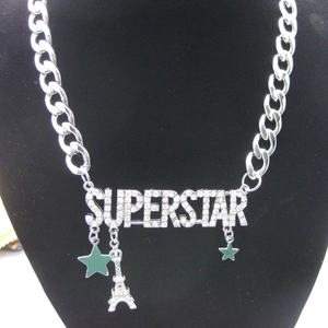 Detail of Superstar crystal pendant with stars and Eiffel Tower on silver chain