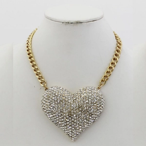 Vintage gold chunky chain necklace with a large heart pendant pavé set with white crystals