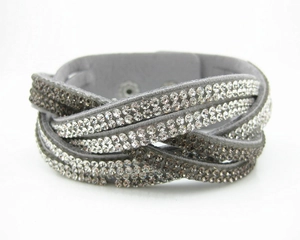 Detail of grey multi-layer wrap bracelet with gradient rhinestones and snap fastener