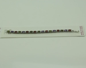 Detailed close-up of a silver bracelet featuring oval-cut colorful zircon gemstones