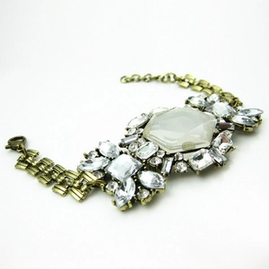 Macro detail of vintage bronze floral bracelet with hexagonal crystal and rhinestones