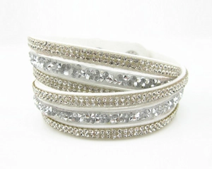 Detail of white velvet multi-layer wrap bracelet with rows of sparkling rhinestones