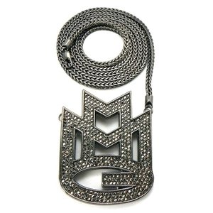 Macro shot of hip hop pendant with dark rhinestones and metal braided chain texture