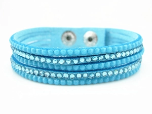Detail of sky blue velvet multi-layer wrap bracelet with crystal rhinestones and snap buttons
