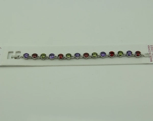 Detailed shot of multicolor zircon bracelet on white card showcasing premium nickel-free finish