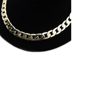 Golden 12mm Cuban chain necklace displayed on a black stand for a minimalist hip hop style