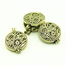 Three-piece set of bronze hollow heart locket pendants with steampunk gear details