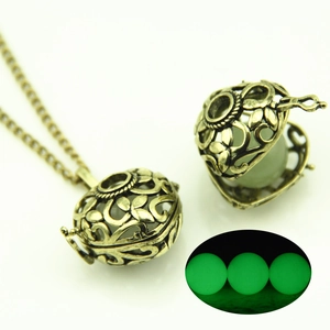 Vintage hollow heart necklace with glowing pendant and antique bronze finish