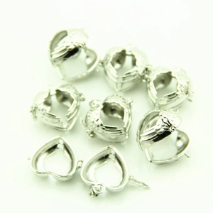 Silver hollow heart-shaped locket pendants with engraved wing patterns for DIY jewelry