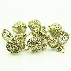 Vintage hollow filigree heart pendant in antique brass for DIY jewelry necklace