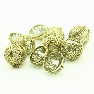 Vintage bronze hollow branch pattern sphere pendant locket in open and closed views