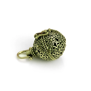 Antique bronze hollow sphere pendant with intricate floral engravings and metal clasp