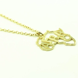 Gold-tone African map pendant necklace with cutout AFRICA lettering on a slim link chain