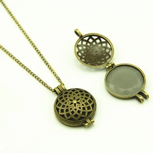 Luminous hollow pendant necklace with round moonstone in vintage bronze finish