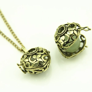 Vintage bronze hollow heart locket necklace with glowing bead inside for women