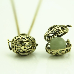 Vintage hollow heart glowing locket necklace with green luminous stone bead pendant