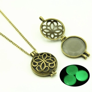 Hollow round glowing necklace with retro bronze pendant showing day and night glow effects