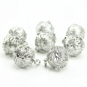Hollow silver metal spherical pendants with intricate branch design for DIY jewelry