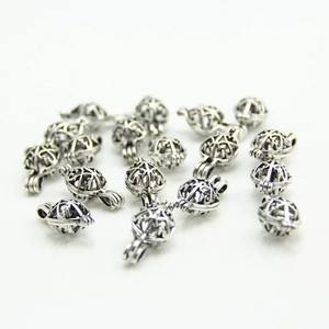 Vintage silver hollow cage pendants for DIY oil diffusers shown in multiple pieces