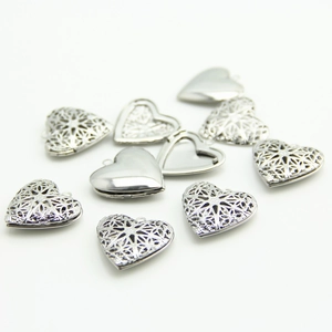 Hollow heart-shaped silver locket pendant with intricate filigree for DIY jewelry