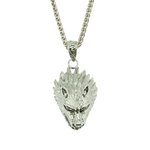 Detailed view of silver wolf head pendant with textured fur and wheat chain necklace