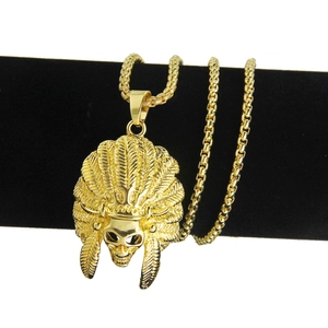 Hip hop style gold plated Indian chief skull pendant necklace on a jewelry display stand