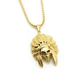 Detailed view of hip hop gold skull pendant with intricate feather headdress and box chain