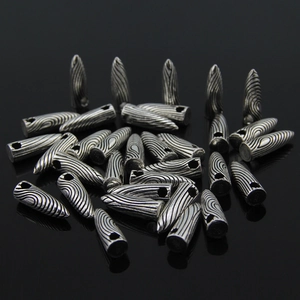 S925 sterling silver bullet pendant beads with vintage swirl texture on black background